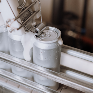 Lids are added to 12-ounce cans on a Starbase aluminum canning line. These craft beers are produced in Austin and shipped all over Texas, including down to the Rio Grande Valley.